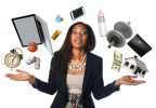 African American businesswoman juggling many objects and feeling overwhelmed